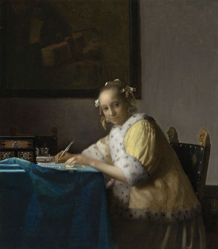 Schrijvende vrouw in het geel - Vermeer